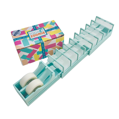 Tape Zoomie fast tape dispenser preparing multiple tape strips for quicker gift wrapping.
